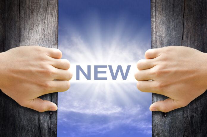 New,Word,Floating,And,Shining,In,The,Sky,While,Two